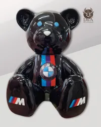 Resin statue of a BMW sitting bear for car enthusiasts